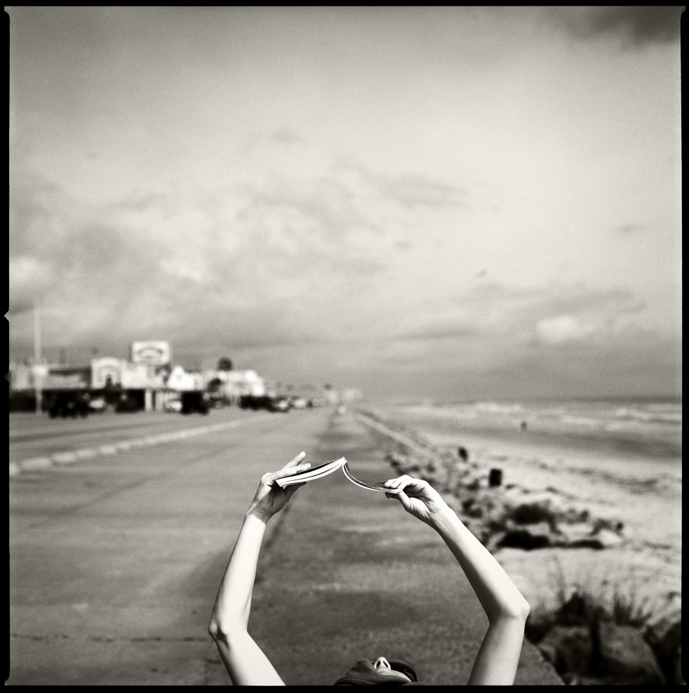 Reading on the Seawall, Galveston, 2005