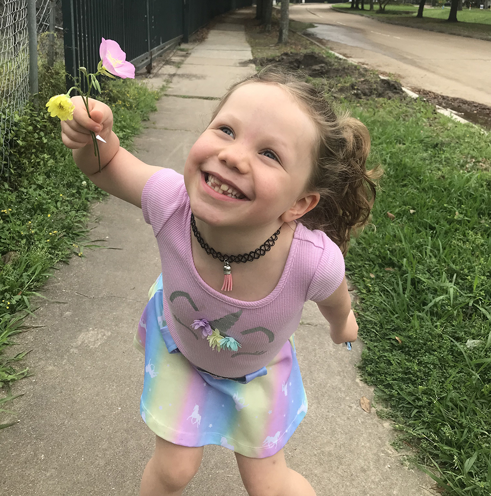 Charlotte with a flower